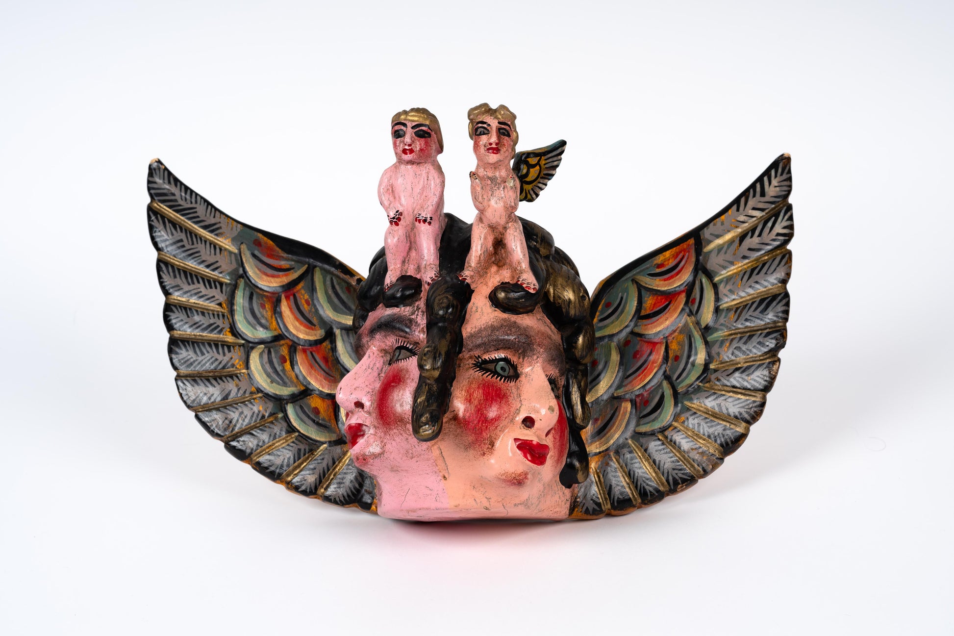 Antique mask of cherubs from Guerrero, Mexico