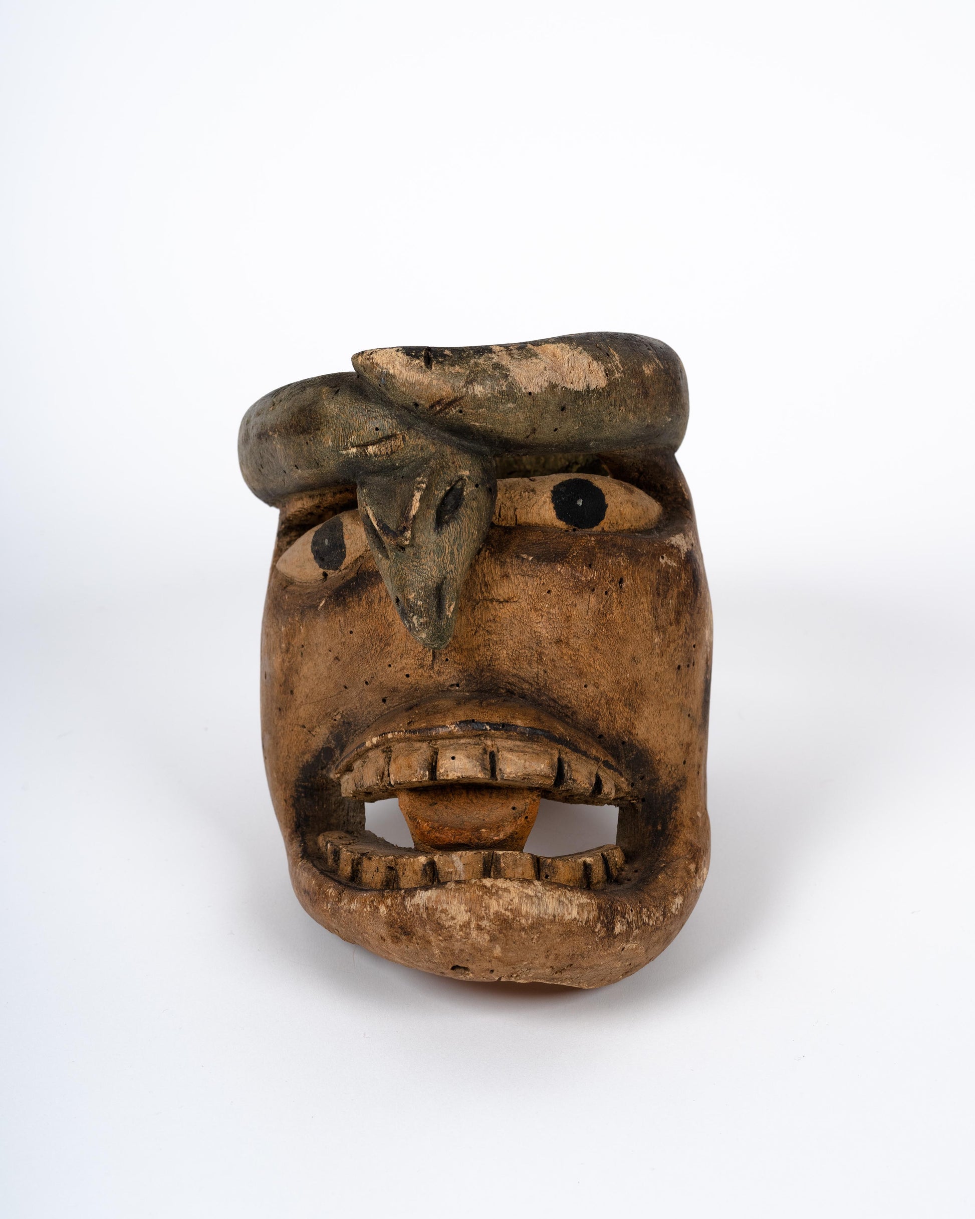 Antique mask of man with snake from Guerrero, Mexico