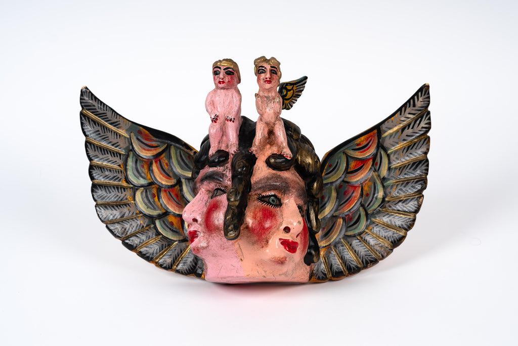 Antique mask of cherubs from Guerrero, Mexico