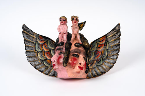 Antique mask of cherubs from Guerrero, Mexico