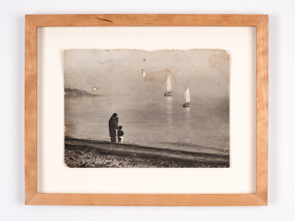 Photograph of woman and child on the shore, Japan