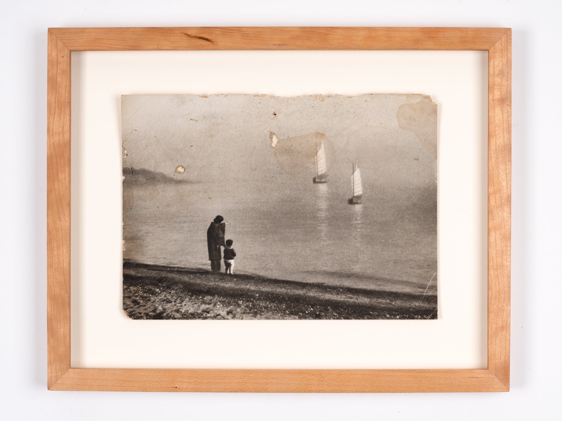 Photograph of woman and child on the shore, Japan